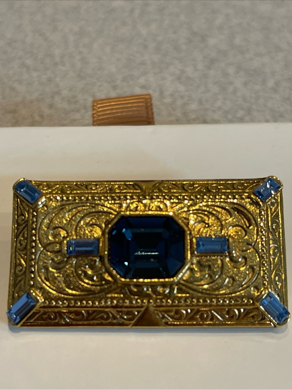 1928 brand gold-tone rectangular brooch with blue glass rhinestones - EUC
